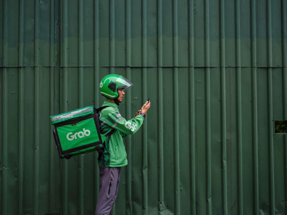 Misteri Akuisisi GoTo-Grab: Siapa Sebenarnya yang Bermain?